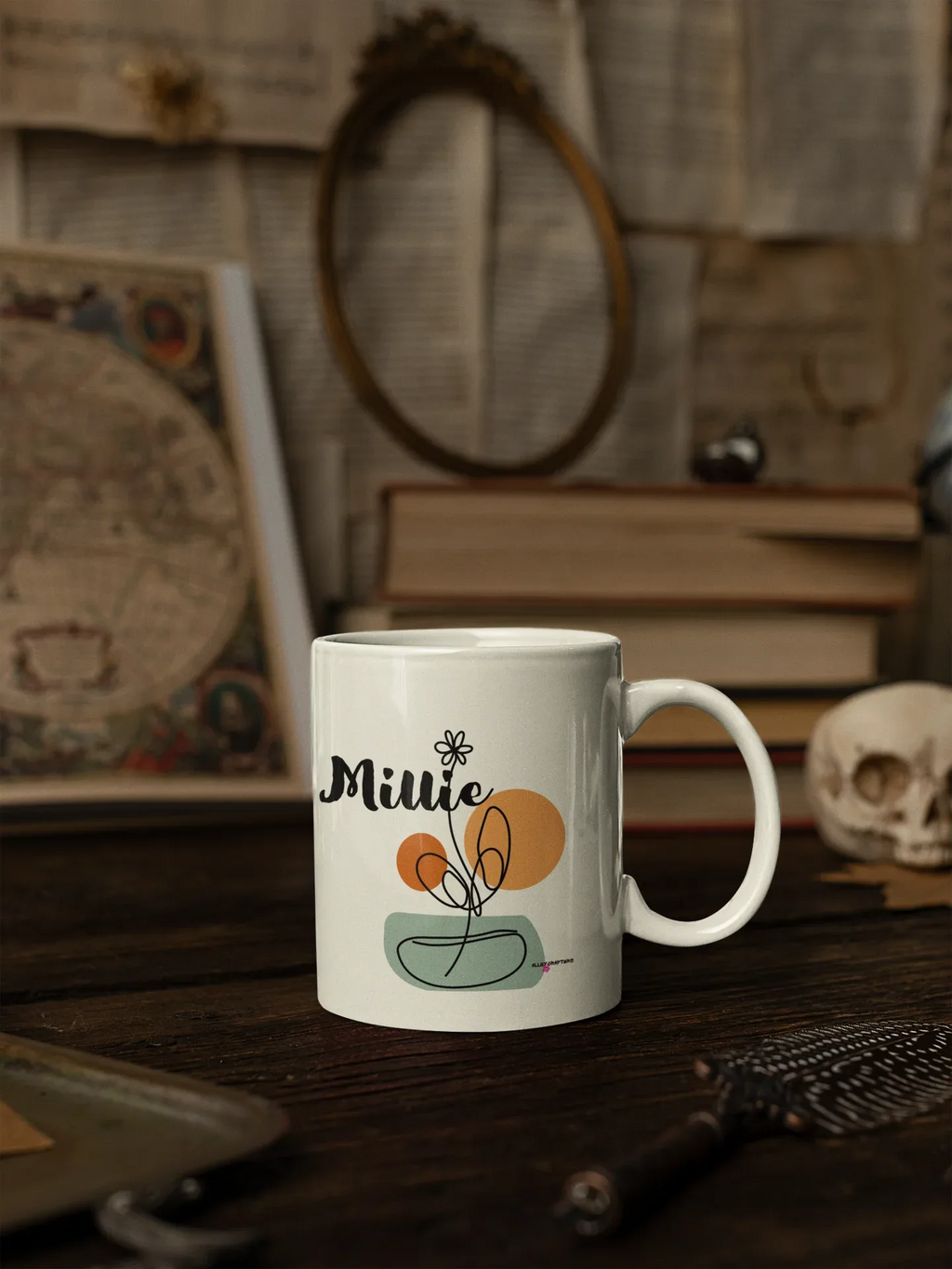 White ceramic mug with personalized Millie name and floral swirl bowl design on front.