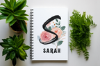White A5 journal with spiral binding, floral initial and name SARAH on cover