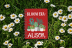 Personalised A5 lined notebook with red cover, floral pots illustration and name ALISON.