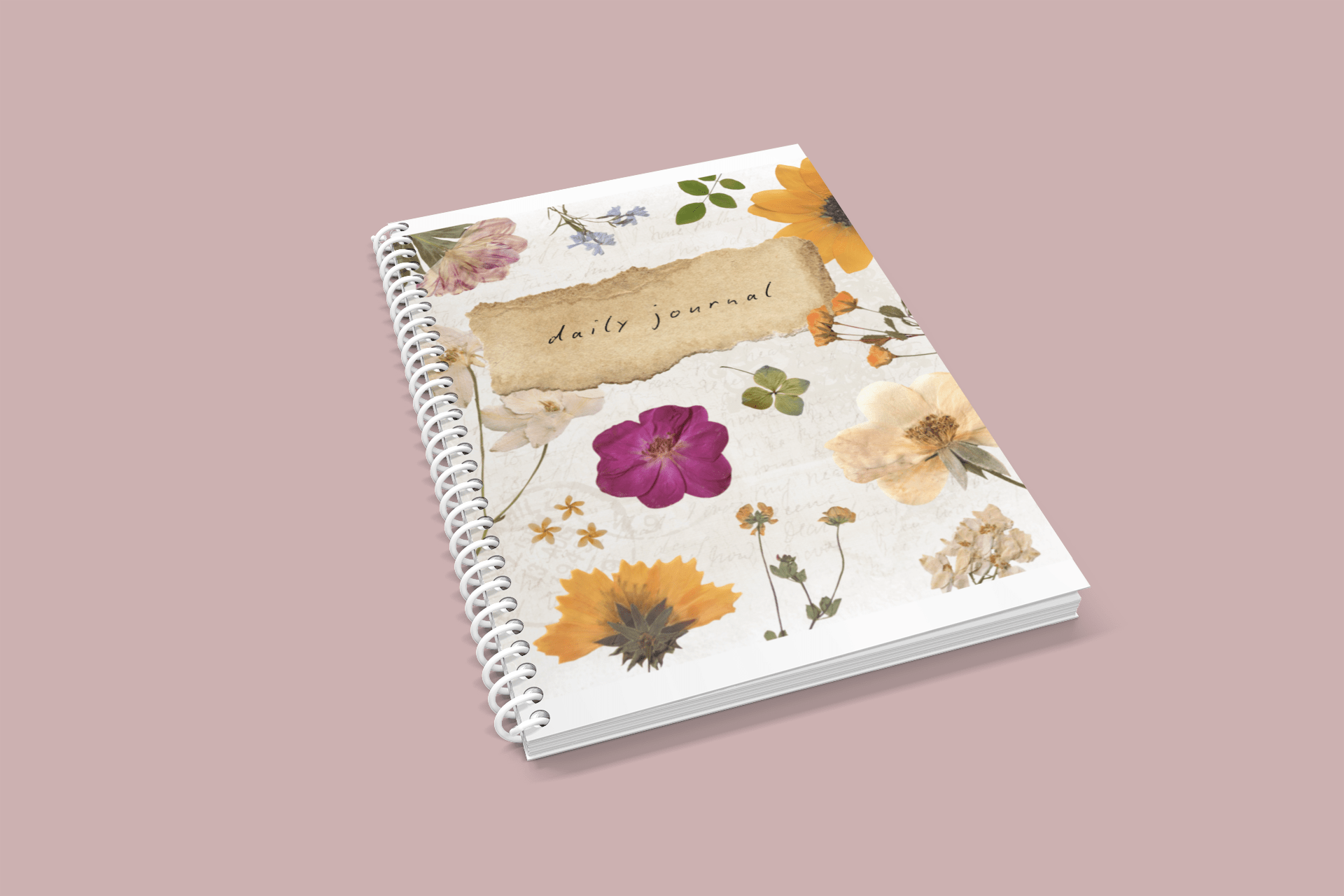 A5 wirebound daily journal notebook with floral softcover, angled on its side.