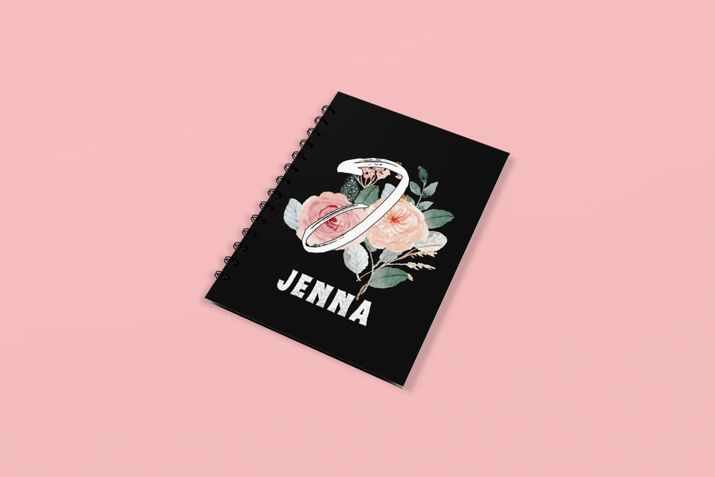 Black wirobound A5 journal with floral initial and name JENNA on the cover
