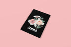Black wirobound A5 journal with floral initial and name JENNA on the cover