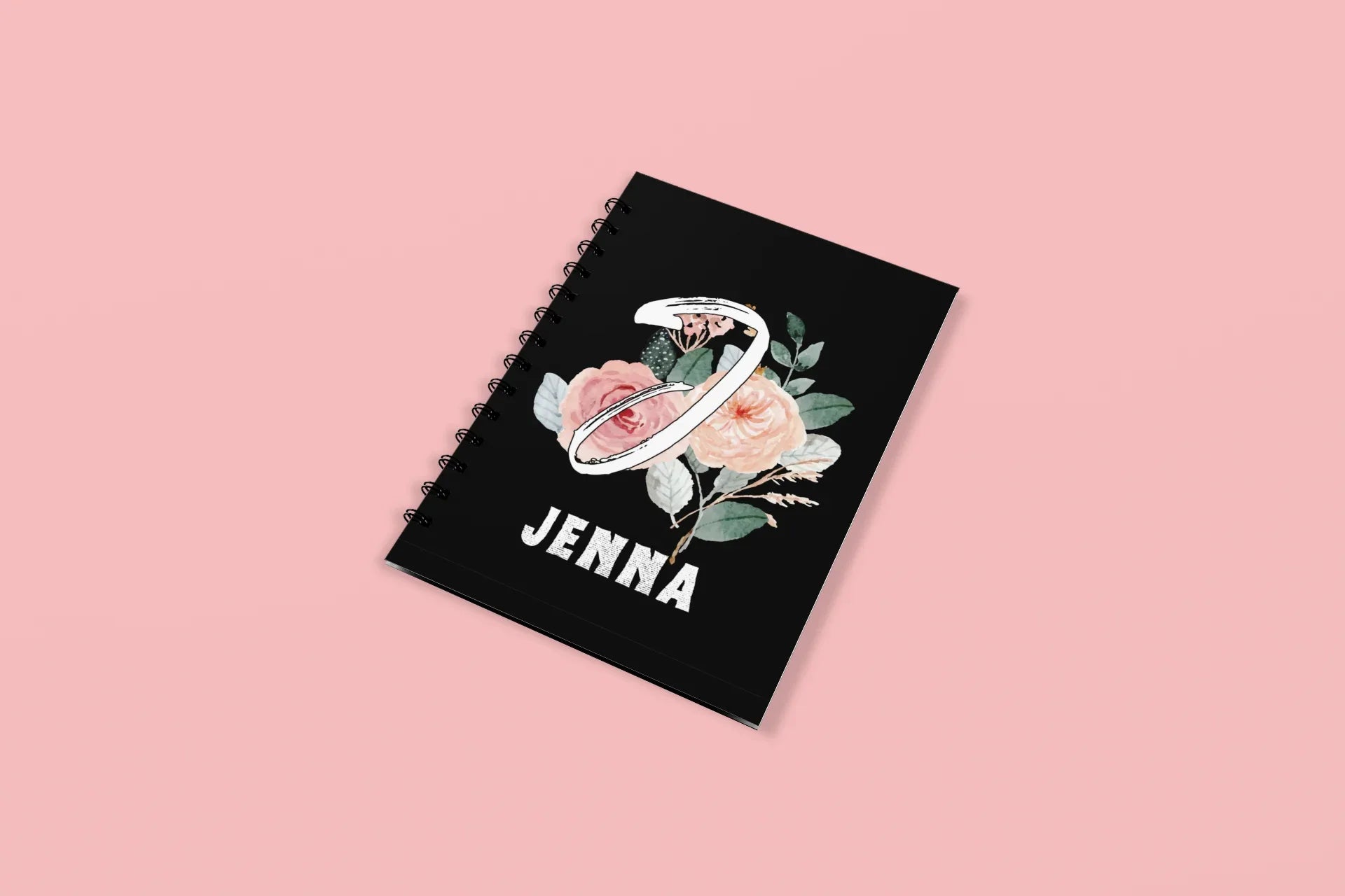 Black wirobound A5 journal with floral initial and name JENNA on the cover