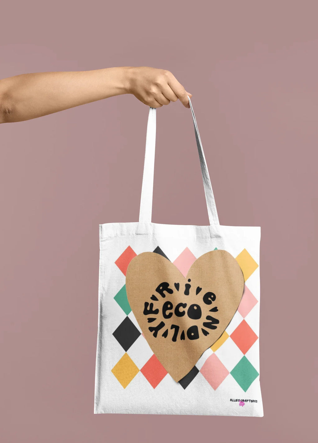 White heart-print tote bag with tan heart graphic and multicolor diamond pattern, short handles