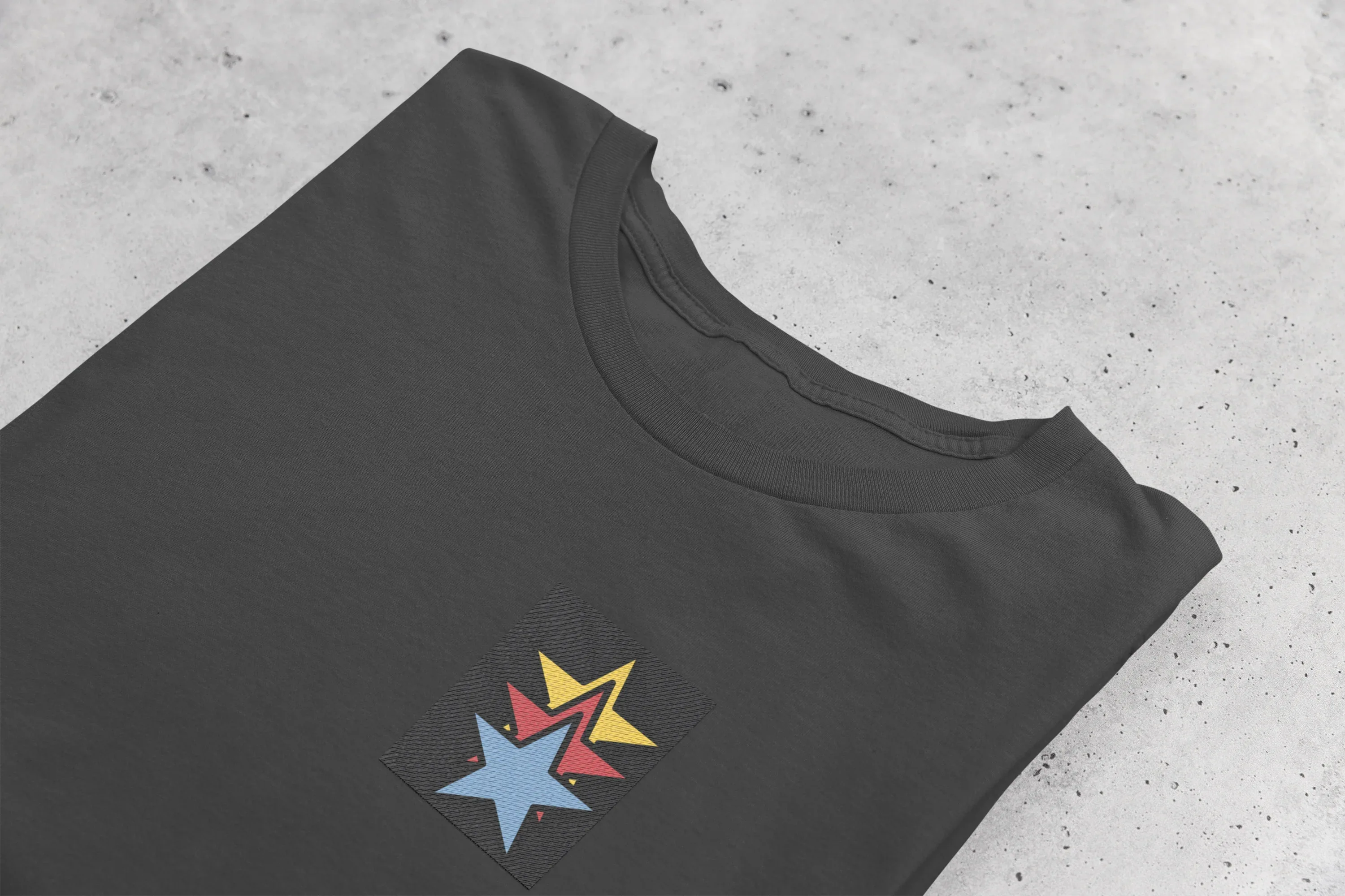 Black unisex sweatshirt angled view with colorful star embroidery on front