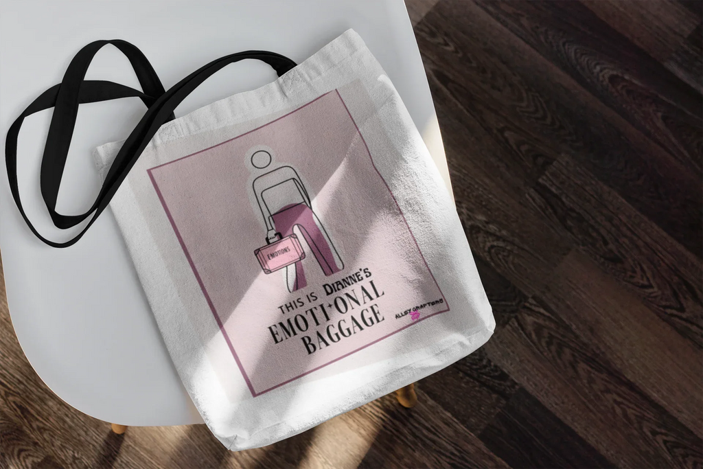 White canvas tote bag with pink graphic panel and black shoulder strap.
