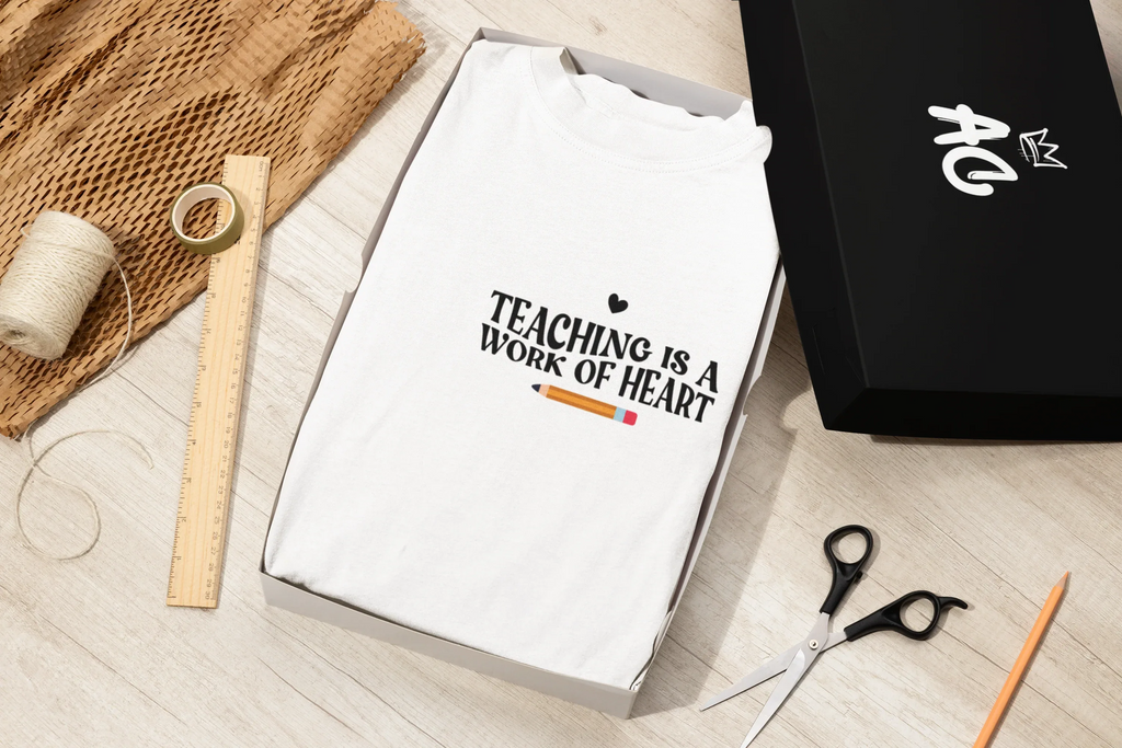 Unisex T-shirt, white crew neck, 'Teaching is a work of heart' centered chest print