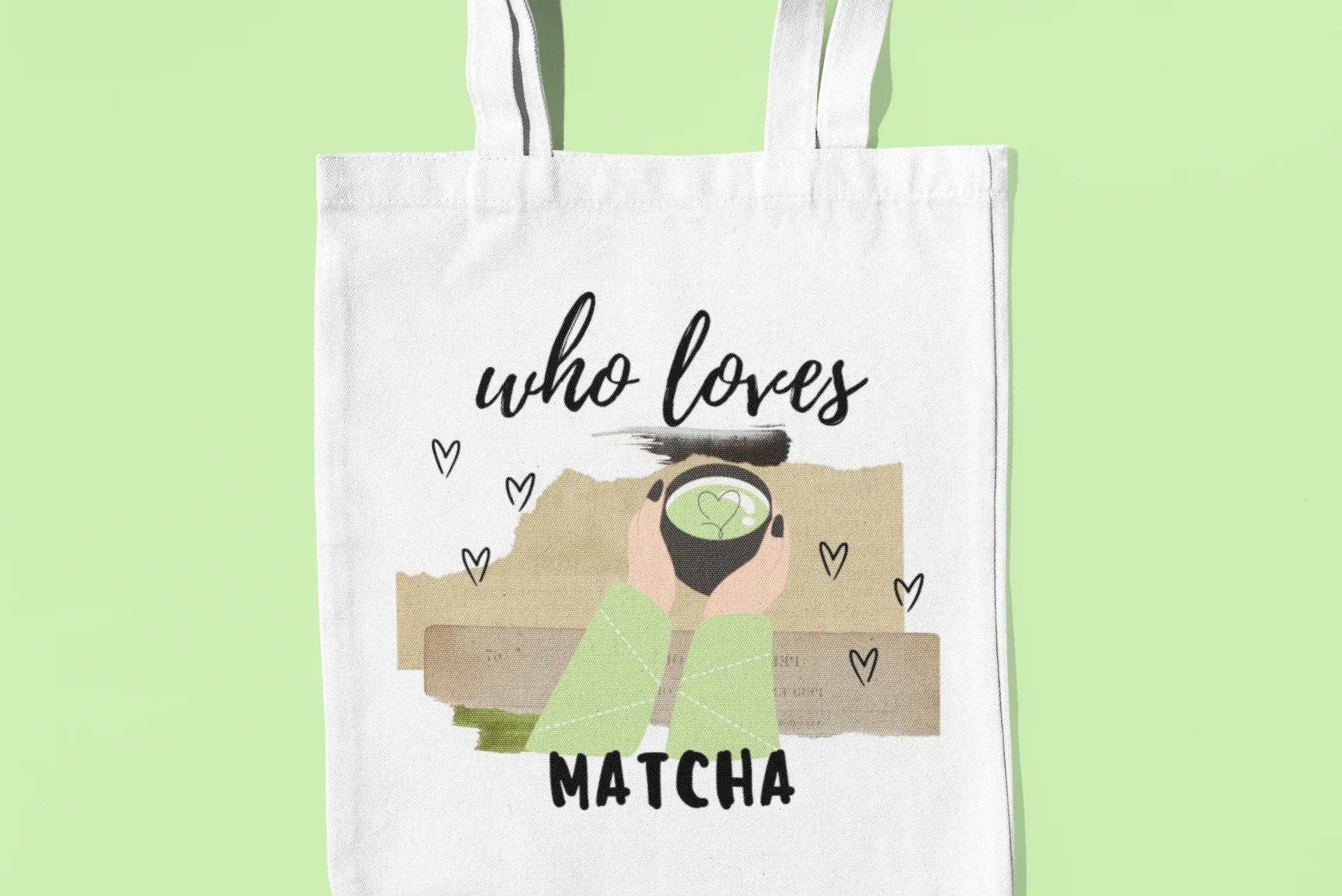White tote bag with “who loves MATCHA” illustration on a flat front view.