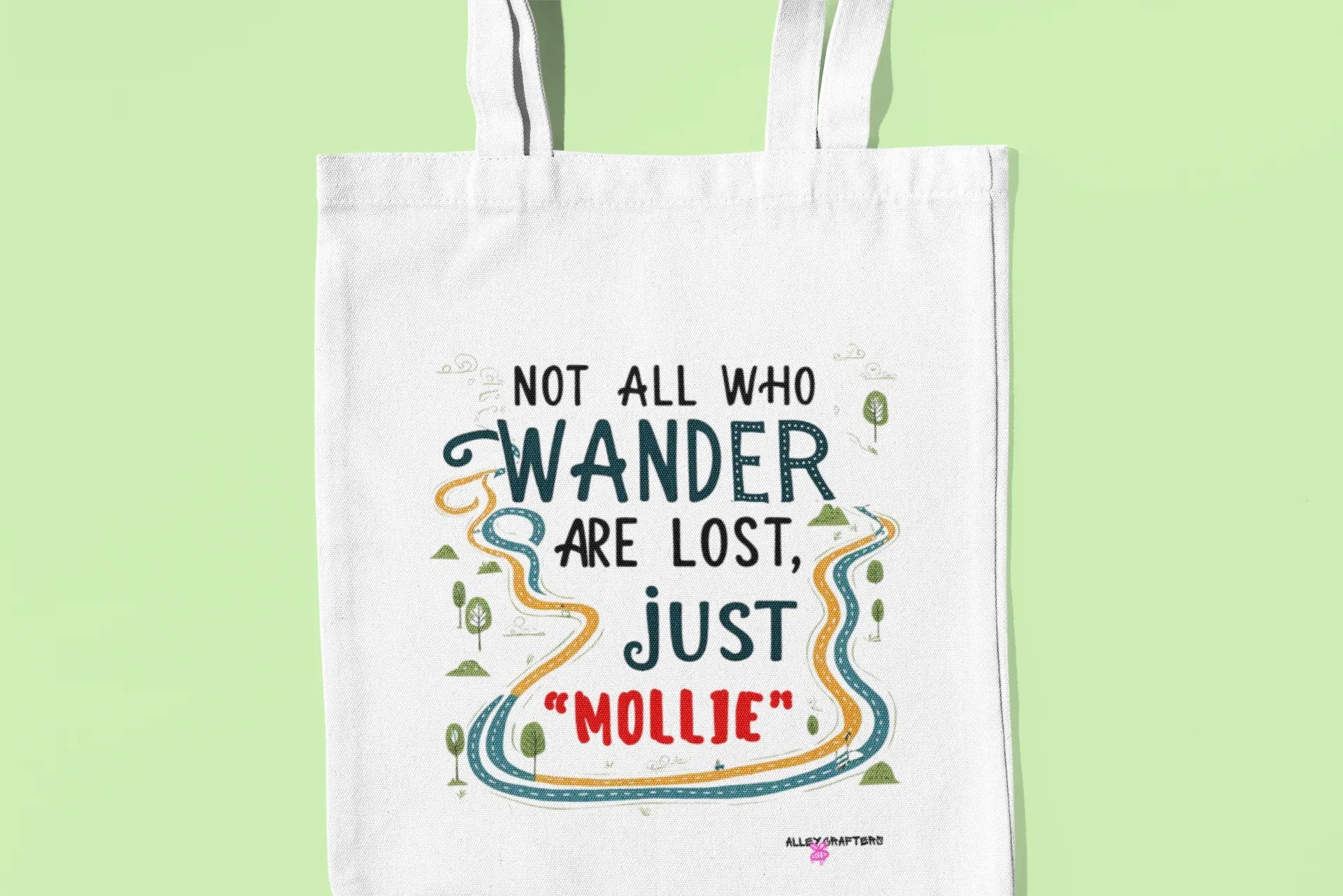 White tote bag with printed quote graphic reading 'MOLLIE' in color
