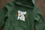 Forest green unisex slogan hoodie chest logo and hood
