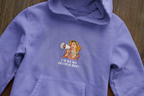 Lavender hooded sweatshirt close-up with woman megaphone graphic on chest and hood