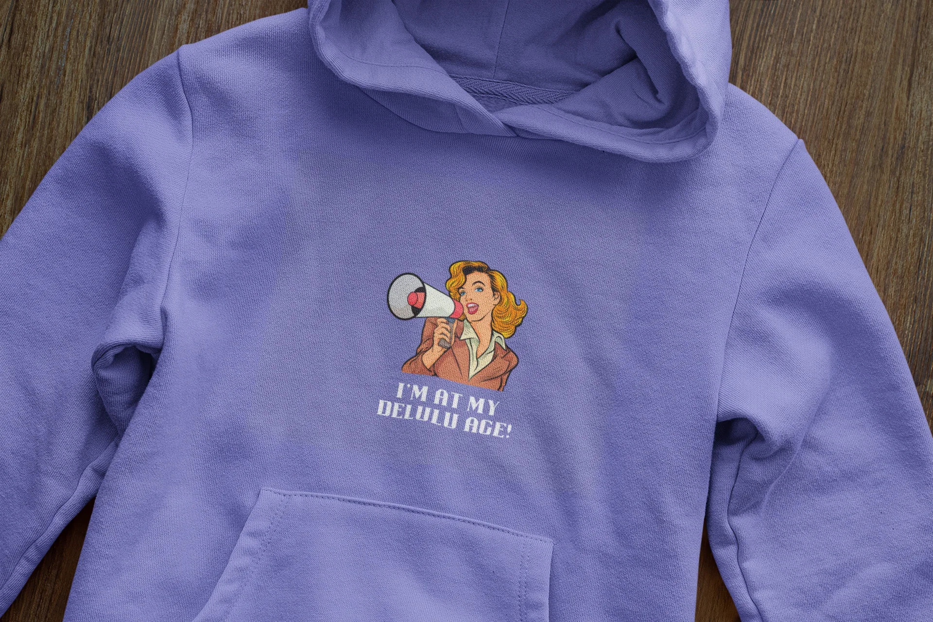 Lavender hooded sweatshirt close-up with woman megaphone graphic on chest and hood