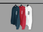 Hanging hoodies in teal, red, and white, each with “Stay Wild Moon Child” chest graphic
