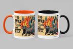 Two ceramic mugs with bear and flames graphic: orange handle and black handle; “TOO WILD FOR HERBAL TEA.”