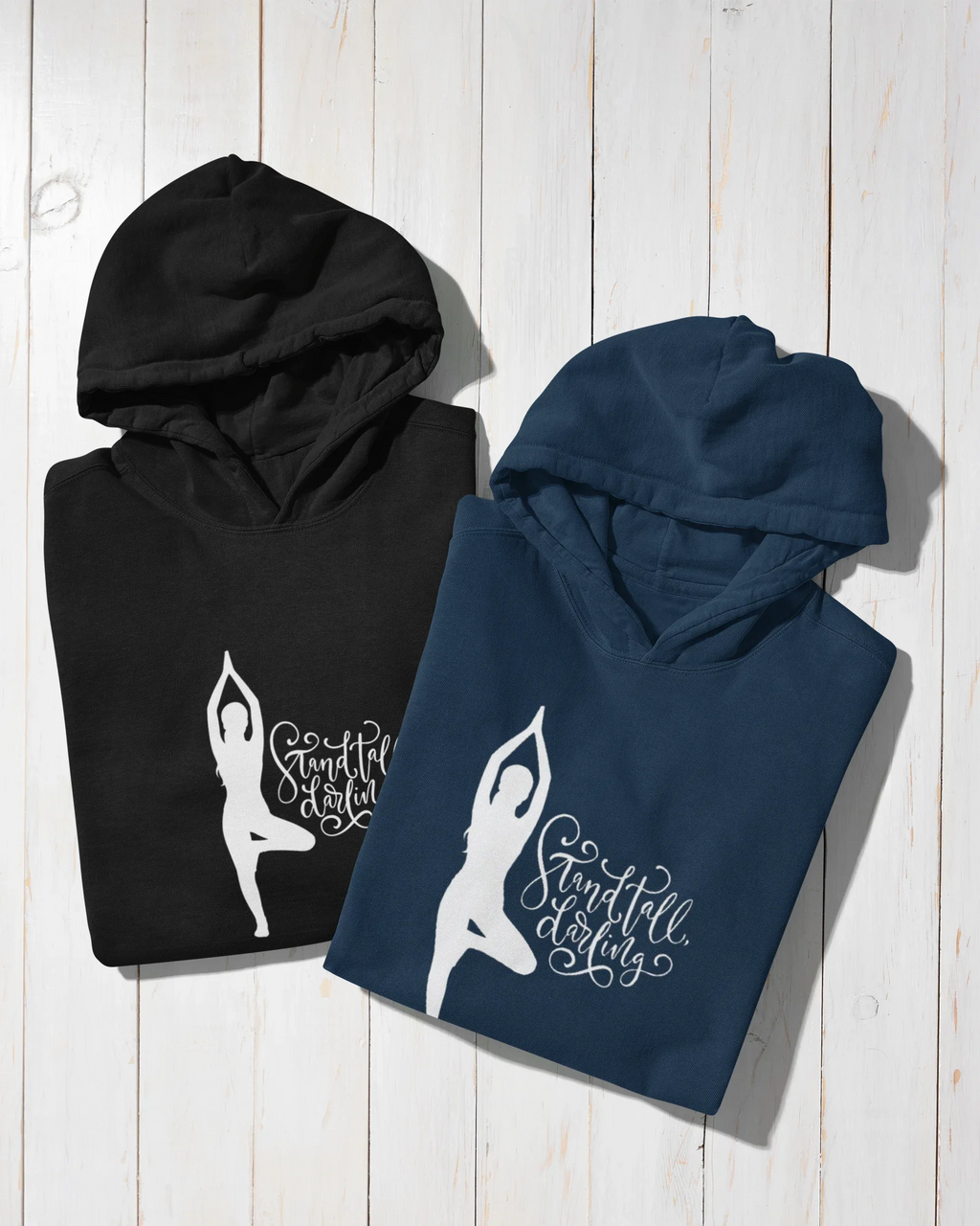 Black and navy hoodies with front kangaroo pockets and yoga silhouette logo.