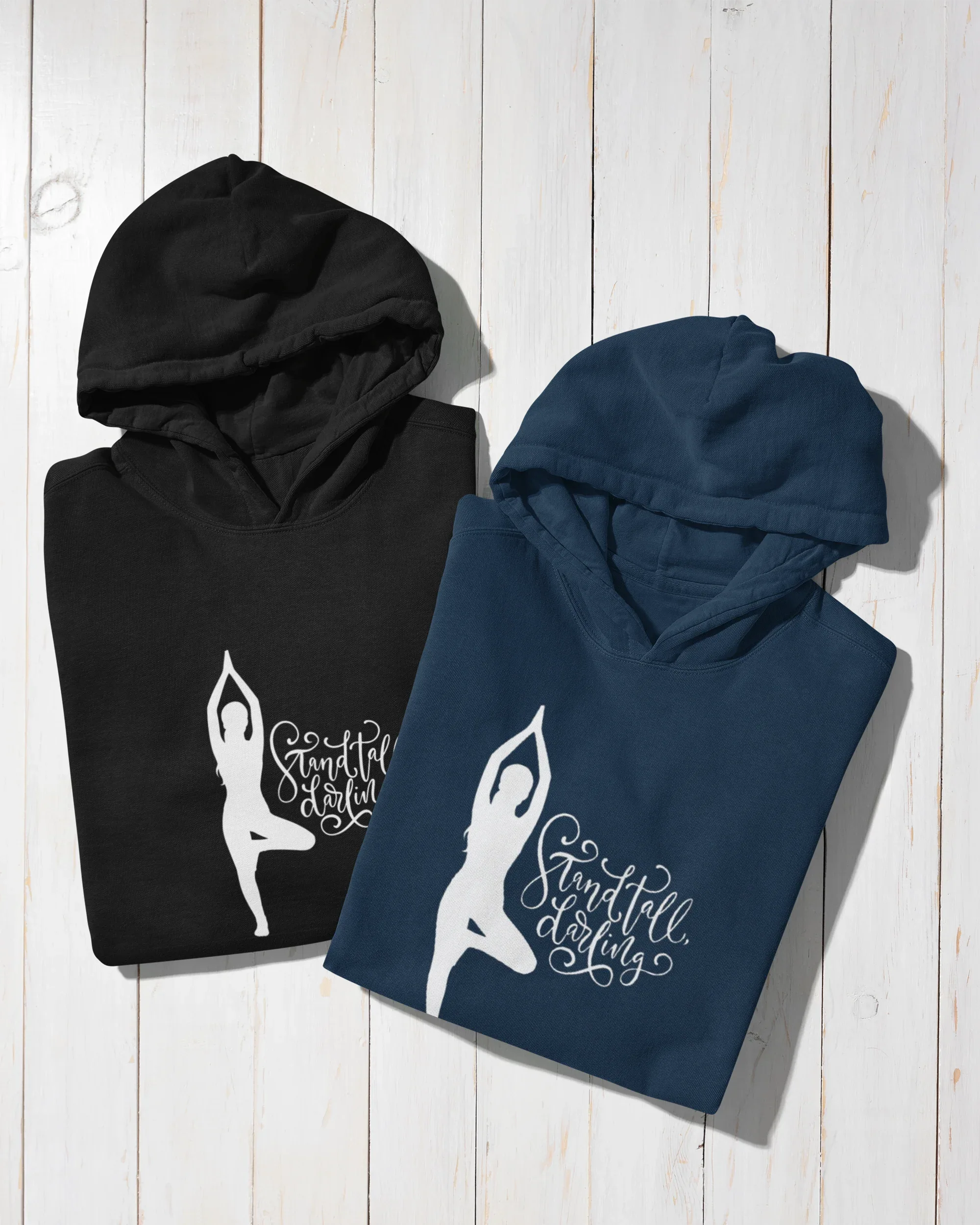 Black and navy hoodies with front kangaroo pockets and yoga silhouette logo.