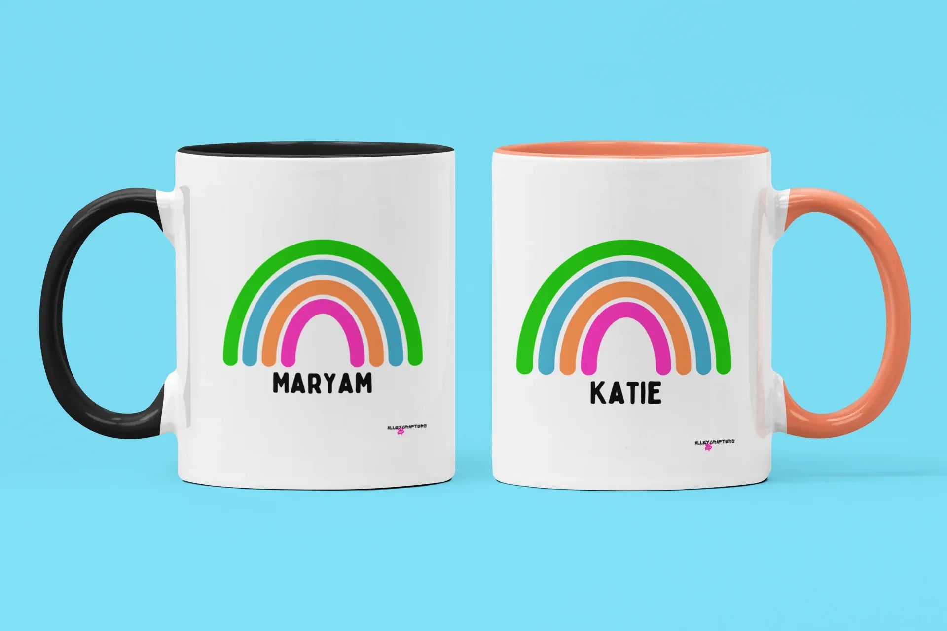 Personalised rainbow mugs set: MARYAM with black handle, KATIE with orange handle, rainbow names