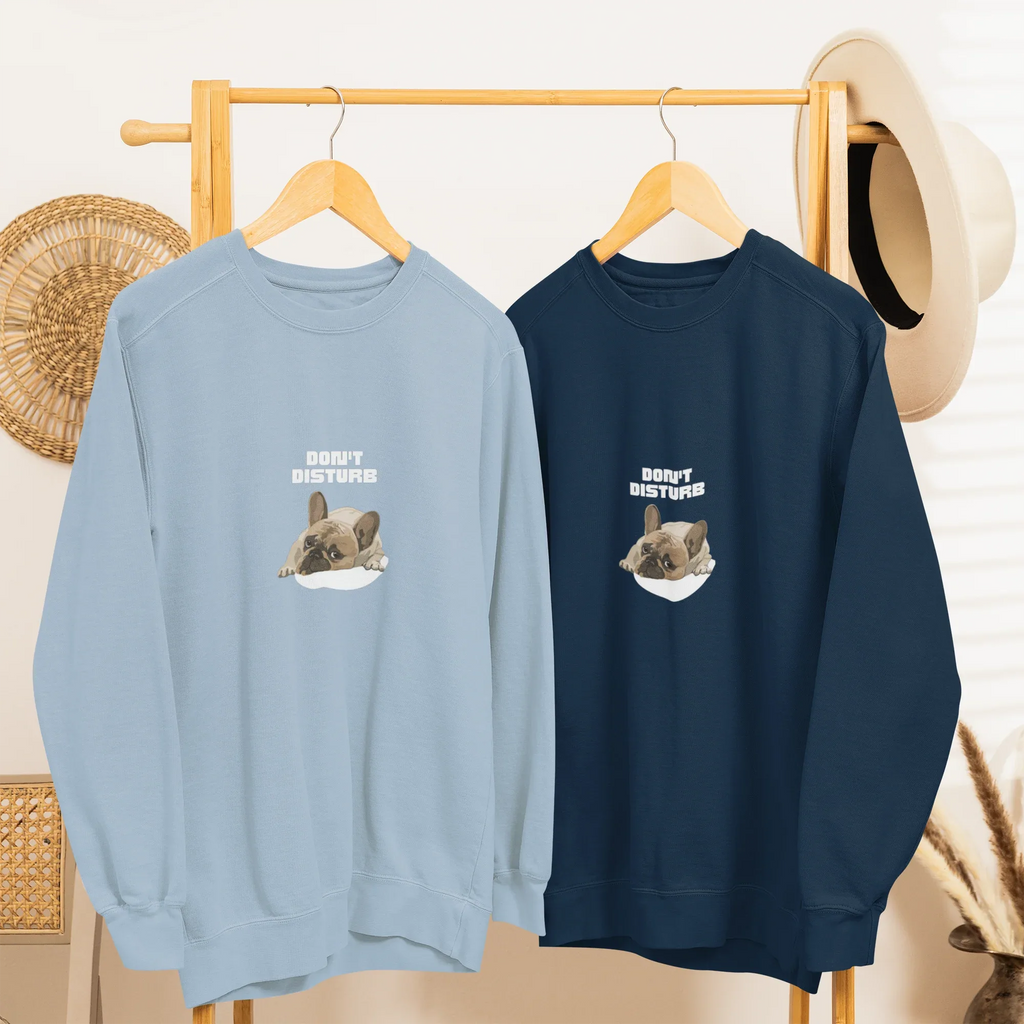 Light blue and deep navy sweatshirts with “DON’T DISTURB” text and sleeping French Bulldog graphic.
