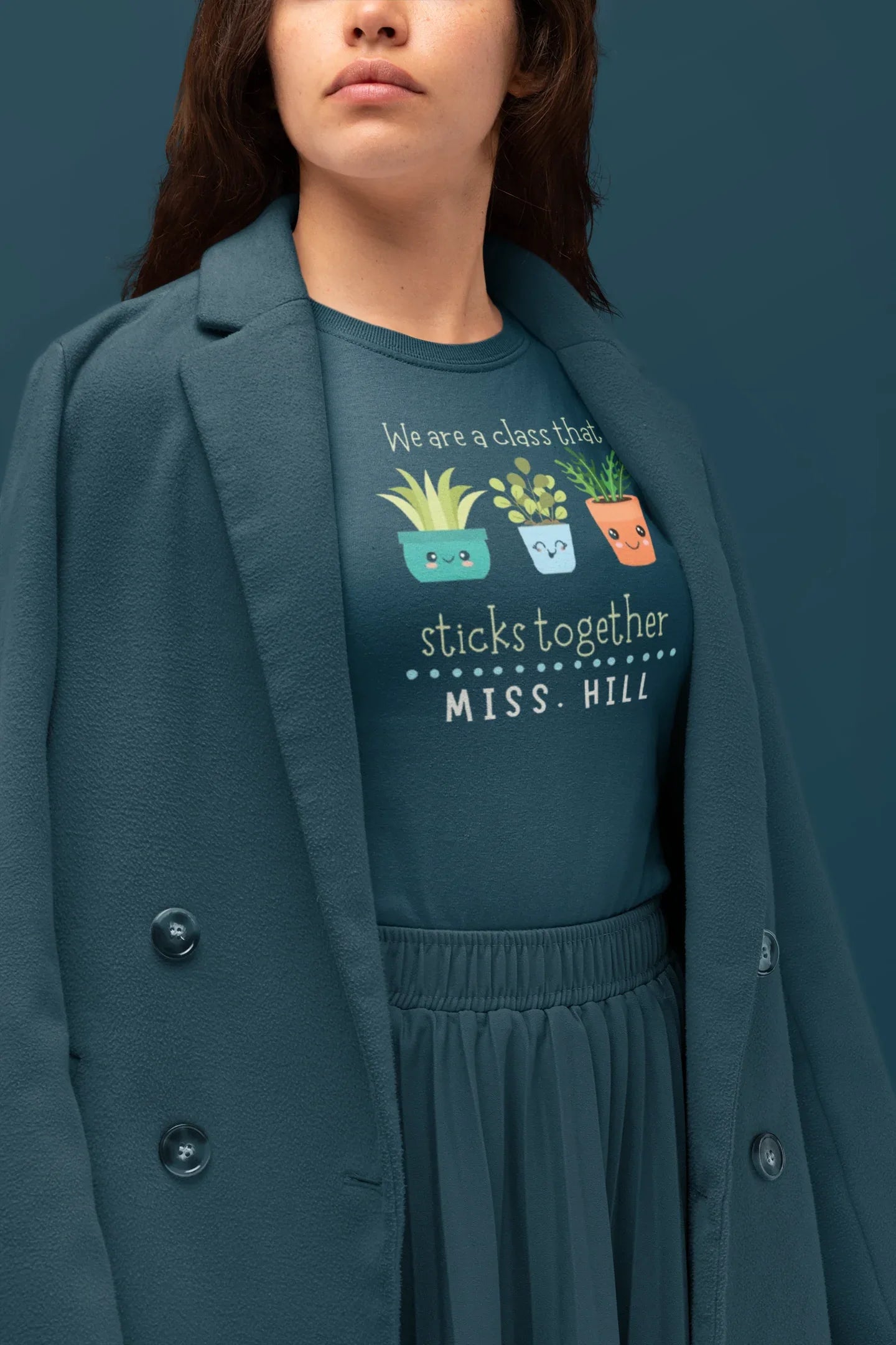 Dark teal teacher t-shirt with cartoon plants and front text graphic