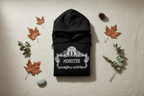 Black Monster Hooded Sweatshirt folded with hood and white monster logo