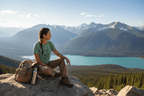 Green custom T-shirt worn by a hiker, featuring mountain graphic and "Off the Grid"