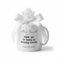 Personalised teacher thank-you mug with bow wrap, 'Mrs Bennett' and 'Class of 2025'.