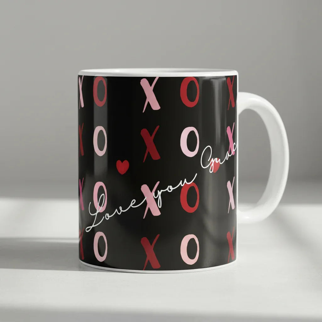 Personalised love mug, black with pink XO pattern and red heart script, white handle