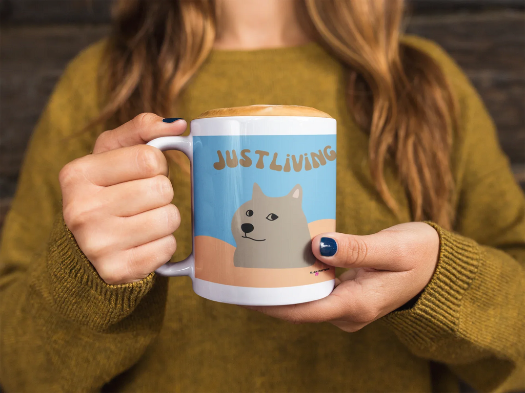 Dog graphic ceramic mug with blue panel and “JUST LIVING” lettering, white handle