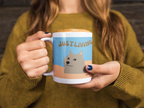 Dog graphic ceramic mug with blue panel and “JUST LIVING” lettering, white handle