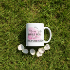 White ceramic coffee mug with pink 'Mum Life Rule No 1: Coffee Before Kids' text