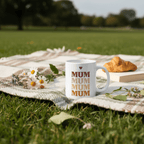 White mug with stacked MUM text and small heart above, cup handle visible