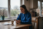 Blue crewneck sweatshirt with LILLY text on chest