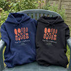 Navy and black Wildflowers hoodies on a patio chair