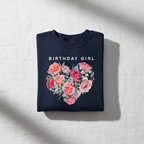 Navy sweatshirt with “BIRTHDAY GIRL” text and floral heart bouquet graphic