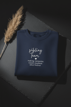 Navy crewneck sweatshirt with 'sibling team' quote graphic on the chest