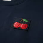 Navy crewneck sweatshirt with cherry embroidered logo patch.