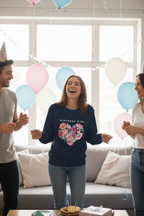 Navy sweatshirt with “BIRTHDAY GIRL” text and colorful floral heart graphic