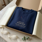 Personalised place name sweatshirt in navy with "meet me here" and BAMBRUGH text