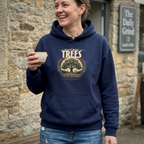 Navy unisex hoodie worn outdoors, with “Plant More Trees” chest graphic and front pocket