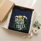 Navy unisex sweatshirt with “Plant More Trees” chest graphic in gift box packaging.