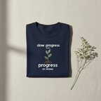 Navy T-shirt with "slow progress" slogan and minimal plant graphic, crew neck.