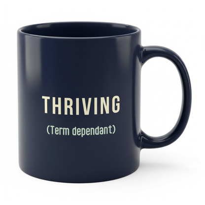 Navy THRIVING mug angled with handle