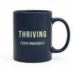 Dark ceramic mug with “THRIVING” and “(Term dependant)” printed on the front.