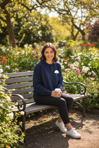 Navy sweatshirt with white tree logo on the chest