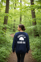 Navy sweatshirt back print reading “BLOOM ERA”