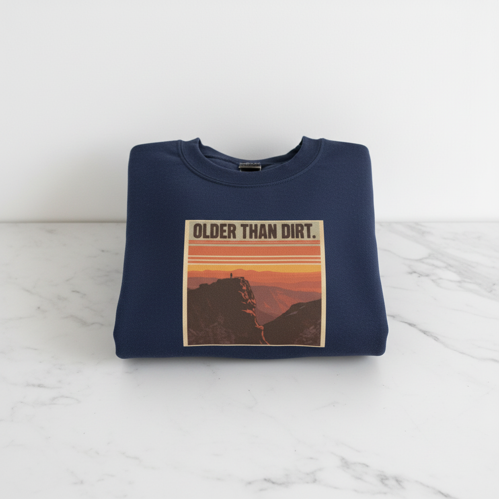 Navy crewneck sweatshirt with mountain sunset graphic and banner-style text