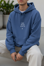 Blue hooded sweatshirt worn by a person with 'No Bad Days' front logo