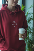 Burgundy hooded sweatshirt with drawstring hood and 'NO BAD DAYS' chest print