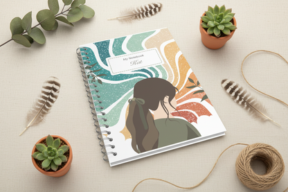 Notebook on linen with feathers and dried flowers