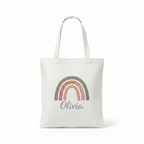White tote bag with rainbow arch graphic and name Olivia